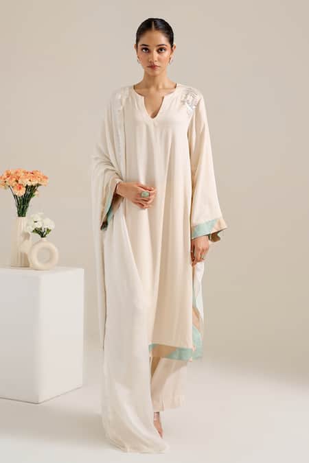 Buy Siyona By Ankurita Ivory Satin Sequins Round Neck Lily Shoulder Embroidered Kurta Set Online at Aza Fashions Buy_Siyona By Ankurita_Ivory Satin Sequins Round Neck Lily Shoulder Embroidered Kurta Set _Online_at_Aza_Fashions