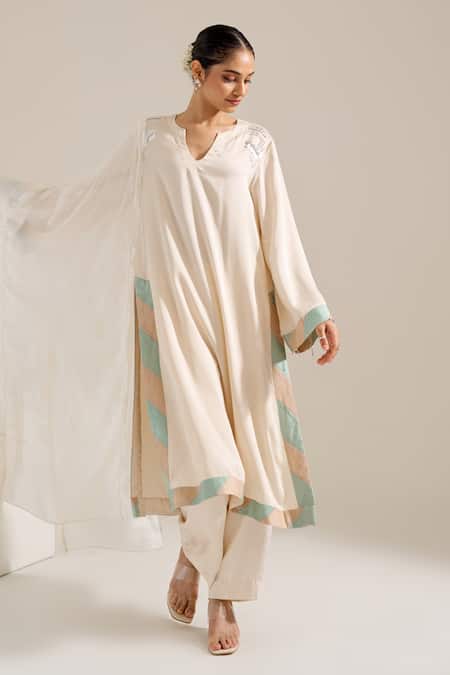 Shop Siyona By Ankurita Ivory Satin Sequins Round Neck Lily Shoulder Embroidered Kurta Set Online at Aza Fashions Shop_Siyona By Ankurita_Ivory Satin Sequins Round Neck Lily Shoulder Embroidered Kurta Set _Online_at_Aza_Fashions