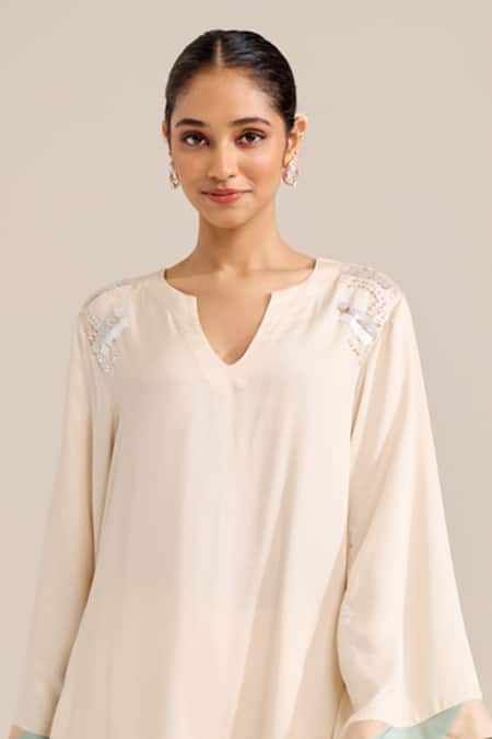 Buy Siyona By Ankurita Ivory Satin Sequins Round Neck Lily Shoulder Embroidered Kurta Set Buy_Siyona By Ankurita_Ivory Satin Sequins Round Neck Lily Shoulder Embroidered Kurta Set