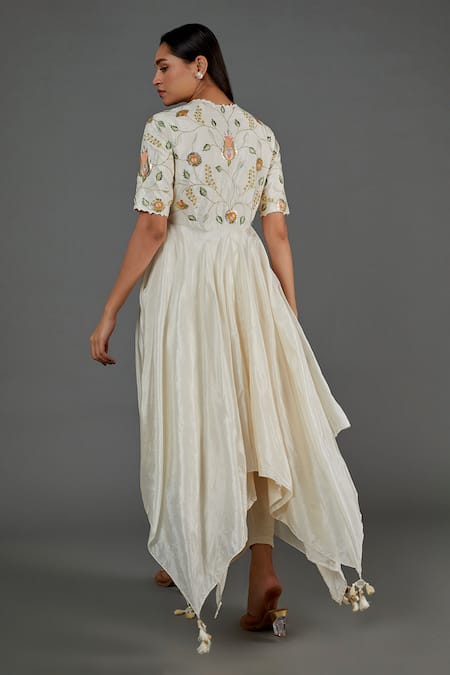 Shop Blue Lotus Design Ivory Cotton, Silk Embroidery Round Neck Floral And Thread Asymmetric Kurta at Aza Fashions Shop_Blue Lotus Design_Ivory Cotton, Silk Embroidery Round Neck Floral And Thread Asymmetric Kurta _at_Aza_Fashions
