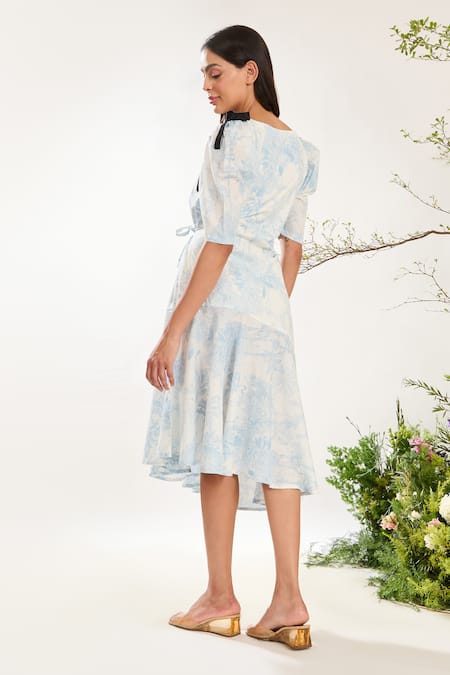 Shop Meadow Blue Cotton Bows V-neck Toile De Jouy Print Asymmetric Dress at Aza Fashions Shop_Meadow_Blue Cotton Bows V-neck Toile De Jouy Print Asymmetric Dress _at_Aza_Fashions