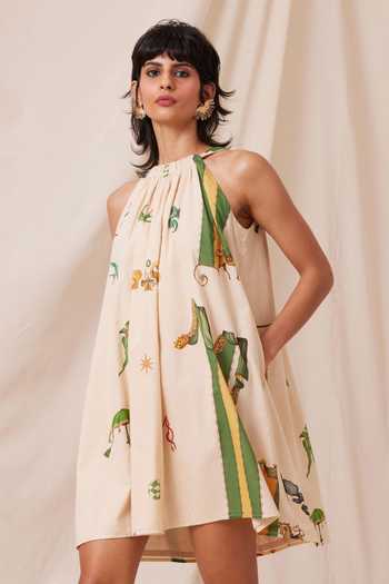The Summer House_Beige Cotton, Voile Halter Neck Chica Carnival Print Gathered Dress_at_Aza_Fashions