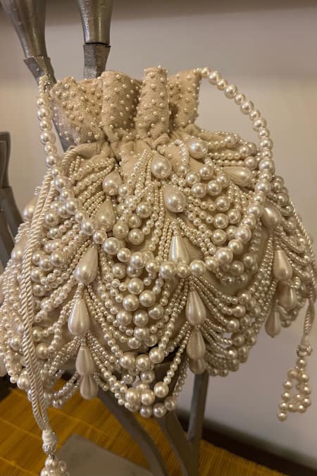 Shop Nayaab By Sonia Ivory Embroidery Velvet Potli Bag at Aza Fashions Shop_Nayaab By Sonia_Ivory Embroidery Velvet Potli Bag _at_Aza_Fashions