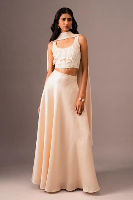 Shop_Vanshika Agarwal Label_Ivory Silk, Brocade Sequins, Tassels Round Neck Embroidered Top And Skirt Set _Online_at_Aza_Fashions