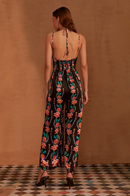 Shop NOIB Black Modal, Satin Halter Neck Chloe Climbing Flower Print Jumpsuit at Aza Fashions Shop_NOIB_Black Modal, Satin Halter Neck Chloe Climbing Flower Print Jumpsuit _at_Aza_Fashions