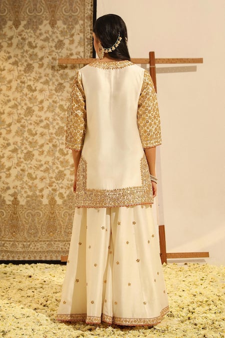 Shop Sheetal Batra Ivory Silk Organza, Silk, Chanderi Shadaab Gota Patti Kurta Sharara Set at Aza Fashions Shop_Sheetal Batra_Ivory Silk Organza, Silk, Chanderi Shadaab Gota Patti Kurta Sharara Set _at_Aza_Fashions