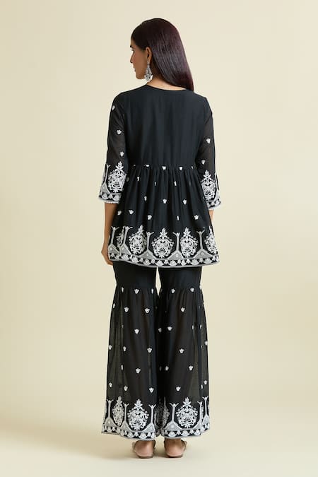 Shop Naintara Bajaj Black Cotton Embroidery, Mirrors V-neck Work Peplum Kurta Sharara Set at Aza Fashions Shop_Naintara Bajaj_Black Cotton Embroidery, Mirrors V-neck Work Peplum Kurta Sharara Set _at_Aza_Fashions