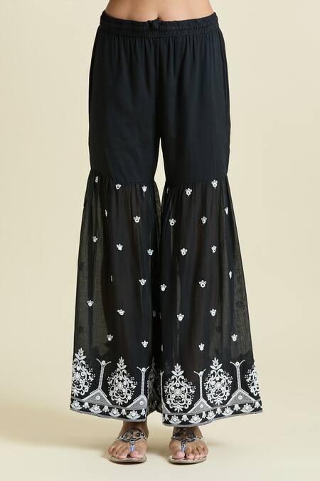 Naintara Bajaj Black Cotton Embroidery, Mirrors V-neck Work Peplum Kurta Sharara Set at Aza Fashions Naintara Bajaj_Black Cotton Embroidery, Mirrors V-neck Work Peplum Kurta Sharara Set _at_Aza_Fashions