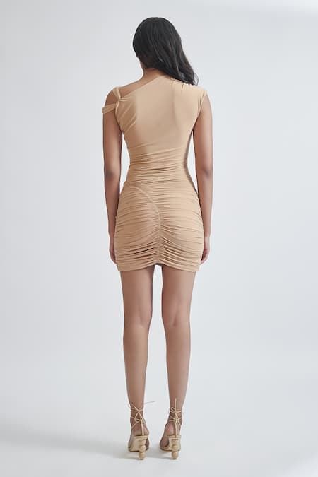 Deme By Gabriella Beige Lycra Asymmetric Amadea Solid Ruched Short Dress Online at Aza Fashions Deme By Gabriella_Beige Lycra Asymmetric Amadea Solid Ruched Short Dress _Online_at_Aza_Fashions