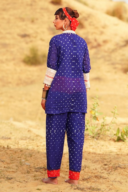 Shop The Home Affair Orange Crepe, Cotton Mirrors, Embroidery Cuff Bandhani Tie Dye Kurta Pant Set at Aza Fashions Shop_The Home Affair_Orange Crepe, Cotton Mirrors, Embroidery Cuff Bandhani Tie Dye Kurta Pant Set _at_Aza_Fashions