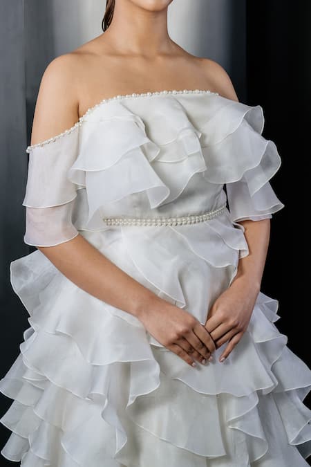 Shriya Som_Ivory Tulle Ruffles, Pearls Off-shoulder Embellished Tiered Gown _Online_at_Aza_Fashions