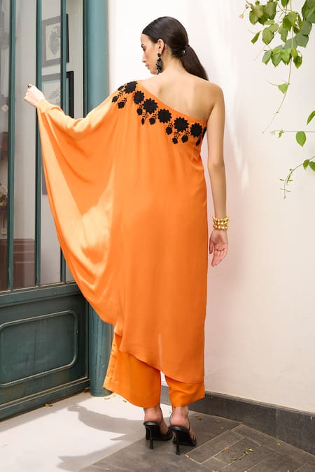 Shop Meesa Orange Crepe Embroidery Asymmetric Placement Kaftan With Pant at Aza Fashions Shop_Meesa_Orange Crepe Embroidery Asymmetric Placement Kaftan With Pant _at_Aza_Fashions