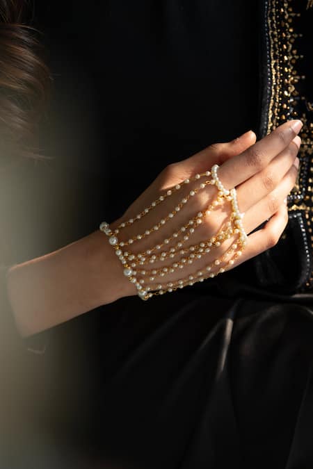 Do Taara_Gold Plated Shell Pearls Embellished Haathphool _Online_at_Aza_Fashions