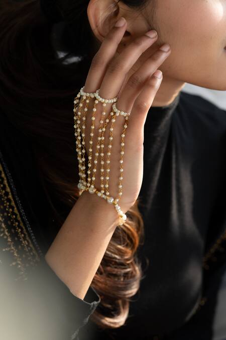 Buy_Do Taara_Gold Plated Shell Pearls Embellished Haathphool _Online_at_Aza_Fashions