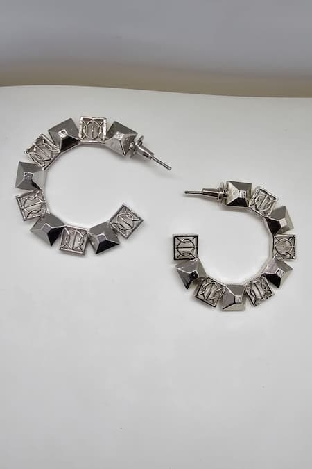 Shop Gaurish Bespoke Jewellery Silver Plated Cut Work Spaced Small Carved Hoop Earrings at Aza Fashions Shop_Gaurish Bespoke Jewellery_Silver Plated Cut Work Spaced Small Carved Hoop Earrings _at_Aza_Fashions