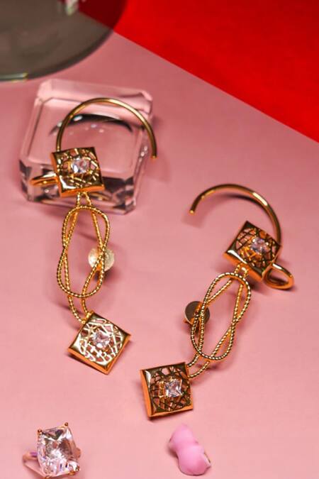 Shop Gaurish Bespoke Jewellery Gold Plated Stones Knotted Signal Earrings at Aza Fashions Shop_Gaurish Bespoke Jewellery_Gold Plated Stones Knotted Signal Earrings _at_Aza_Fashions