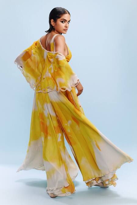 Shop Dolly J Yellow Chiffon Pearls, Sequins V-neck Ruya Watercolour Print Jumpsuit With Cape at Aza Fashions Shop_Dolly J_Yellow Chiffon Pearls, Sequins V-neck Ruya Watercolour Print Jumpsuit With Cape _at_Aza_Fashions