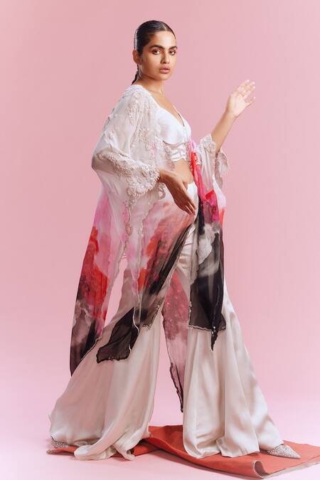 Shop_Dolly J_White Satin Pearls, Sequins Amaya Watercolour Print Cape Flared Pant Set _Online_at_Aza_Fashions