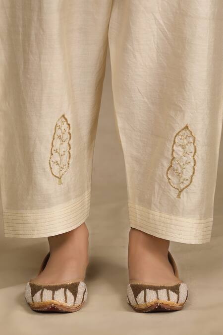 Trendy Tokari Ivory Silk, Chanderi Cut Work, Embroidery, Mirrors V-neck Flared Kurta Pant Set at Aza Fashions Trendy Tokari_Ivory Silk, Chanderi Cut Work, Embroidery, Mirrors V-neck Flared Kurta Pant Set _at_Aza_Fashions