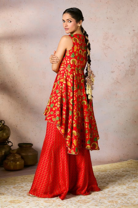 Shop Masaba Red Silk Gota Patti V-neck Nomadic Tribe Printed Asymmetric Tunic And Sharara Set at Aza Fashions Shop_Masaba_Red Silk Gota Patti V-neck Nomadic Tribe Printed Asymmetric Tunic And Sharara Set_at_Aza_Fashions