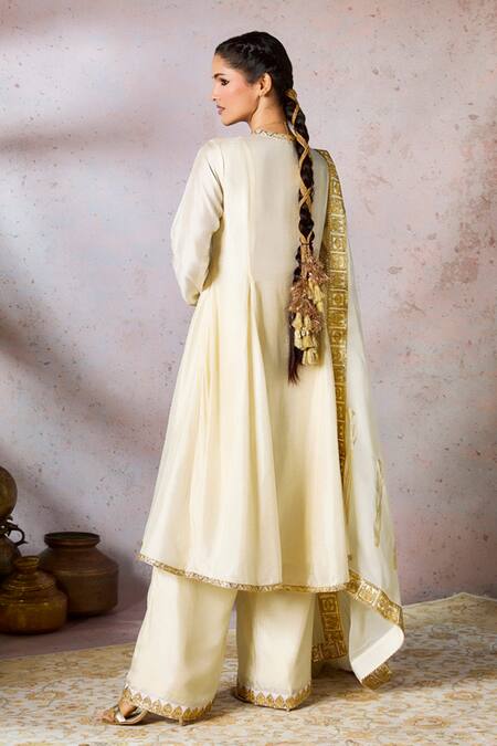 Shop Masaba Ivory Silk, Organza Embroidery V-neck Whispering Lily Neckline Kurta Pant Set at Aza Fashions Shop_Masaba_Ivory Silk, Organza Embroidery V-neck Whispering Lily Neckline Kurta Pant Set_at_Aza_Fashions