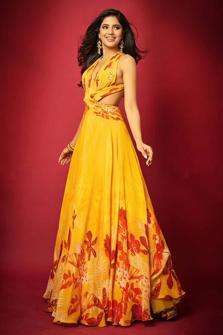 Shop_Mandira Wirk Resort_Yellow Chiffon Halter Neck Orchid Print Cutout Maxi Dress _Online_at_Aza_Fashions