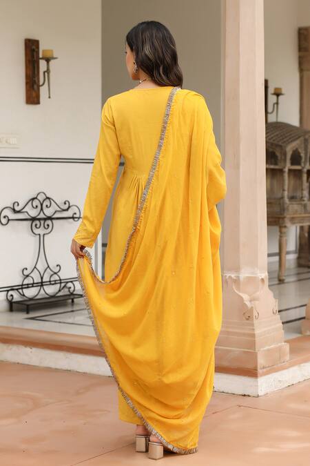 Shop Pheeta Yellow Mulmul Embroidery Fringe Lace V-neck Yoke Gathered Anarkali And Pant Set at Aza Fashions Shop_Pheeta_Yellow Mulmul Embroidery Fringe Lace V-neck Yoke Gathered Anarkali And Pant Set_at_Aza_Fashions