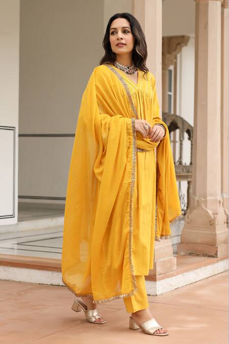 Shop Pheeta Yellow Mulmul Embroidery Fringe Lace V-neck Yoke Gathered Anarkali And Pant Set Online at Aza Fashions Shop_Pheeta_Yellow Mulmul Embroidery Fringe Lace V-neck Yoke Gathered Anarkali And Pant Set_Online_at_Aza_Fashions