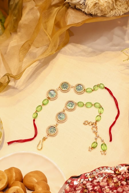 Shlok Jewels Green Crystals, Gemstones Kundan Embellished Rakhi And Lumba Set