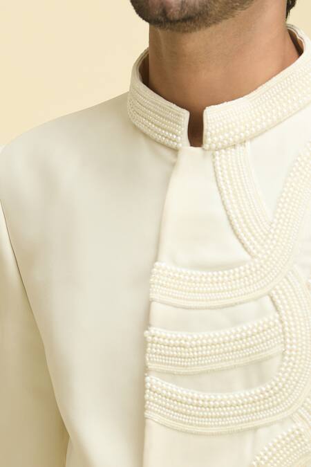 Arihant Rai Sinha Ivory Lycra, Polyester, Taffeta Pearls Wave Embroidered Bandhgala With Pant at Aza Fashions Arihant Rai Sinha_Ivory Lycra, Polyester, Taffeta Pearls Wave Embroidered Bandhgala With Pant_at_Aza_Fashions