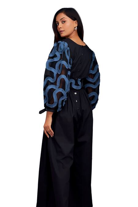 Shop Deepika Arora Black Cotton V-neck Contrasting Pleated Frill Jumpsuit Online at Aza Fashions Shop_Deepika Arora_Black Cotton V-neck Contrasting Pleated Frill Jumpsuit_Online_at_Aza_Fashions