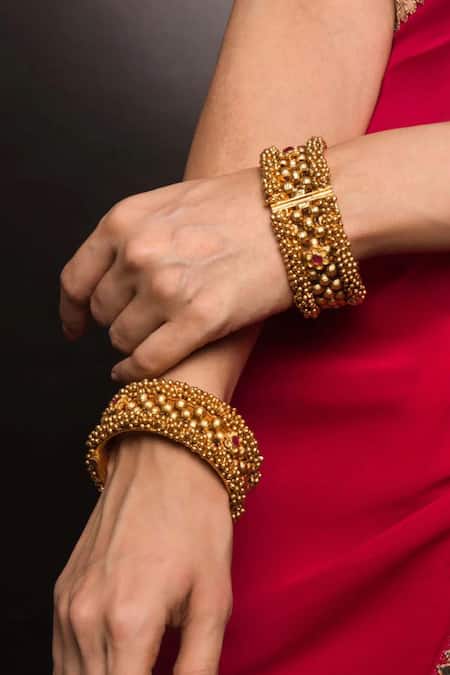 Shop_Queens Jewels_Gold Plated Stones Divine Embellished Temple Kada - Set Of 2 _at_Aza_Fashions