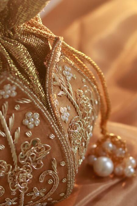 The Tan Clan Gold Cut Work, Pearls, Zari Pushp Silk Hand Embroidered Potli at Aza Fashions The Tan Clan_Gold Cut Work, Pearls, Zari Pushp Silk Hand Embroidered Potli _at_Aza_Fashions