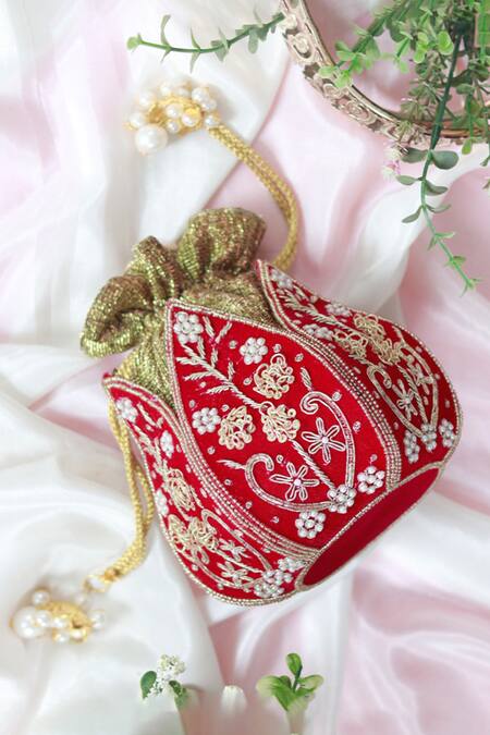 The Tan Clan Red Zardozi Pushp Silk Lotus Embroidered Potli at Aza Fashions The Tan Clan_Red Zardozi Pushp Silk Lotus Embroidered Potli _at_Aza_Fashions