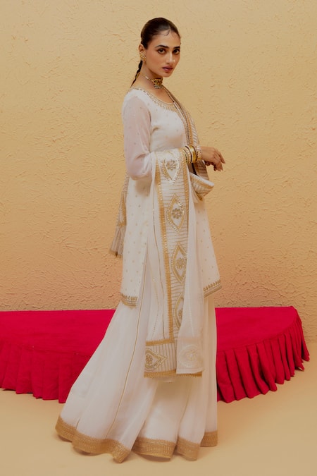 Buy Ranian White Georgette Gota Patti Round Neck Work Kurta Lehenga Set Online at Aza Fashions Buy_Ranian_White Georgette Gota Patti Round Neck Work Kurta Lehenga Set _Online_at_Aza_Fashions