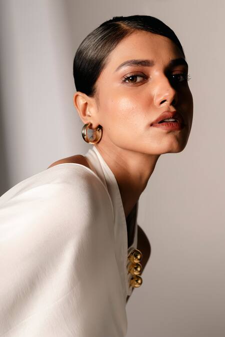 Karishma Kajaria_White Silk Satin Halter Neck Assymetric Dress _at_Aza_Fashions