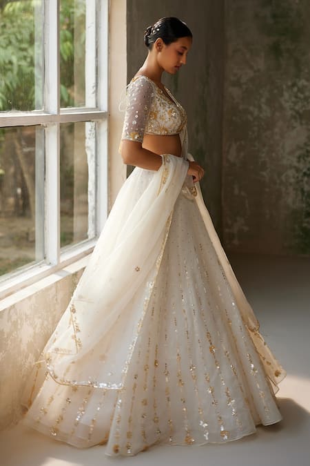 Zoon_Ivory Net, Crepe, Silk Organza Sequins, Embroidery Aari Hand Skirt Blouse Set _at_Aza_Fashions