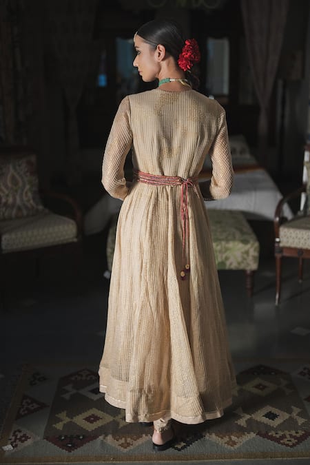 Shop Swatti Kapoor Gold Silk Organza Foil Printed V Neck Ekkam Woven Striped Anarkali at Aza Fashions Shop_Swatti Kapoor_Gold Silk Organza Foil Printed V Neck Ekkam Woven Striped Anarkali _at_Aza_Fashions