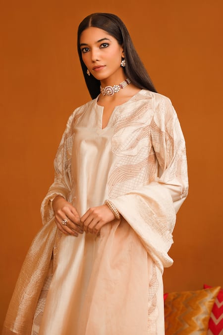 Omana By Ranjana Bothra Ivory Cotton Satin, Crepe Applique, Beads Split V-neck Floral Kurta Trouser Set at Aza Fashions Omana By Ranjana Bothra_Ivory Cotton Satin, Crepe Applique, Beads Split V-neck Floral Kurta Trouser Set _at_Aza_Fashions