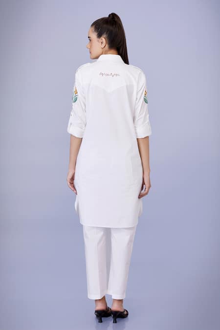 Shop Dilnaz White Cotton Embroidery Collared Aster Flora Tunic With Trouser at Aza Fashions Shop_Dilnaz_White Cotton Embroidery Collared Aster Flora Tunic With Trouser_at_Aza_Fashions