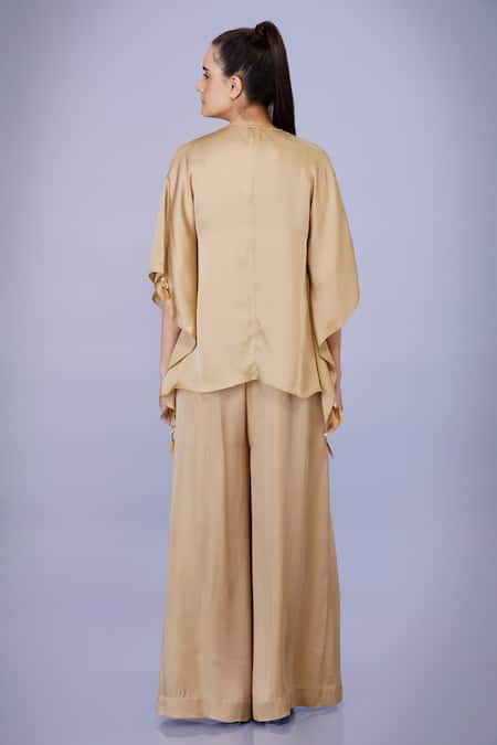 Shop Dilnaz Gold Blended Satin Plain V Neck Tassel Work Kaftan With Jumpsuit at Aza Fashions Shop_Dilnaz_Gold Blended Satin Plain V Neck Tassel Work Kaftan With Jumpsuit_at_Aza_Fashions