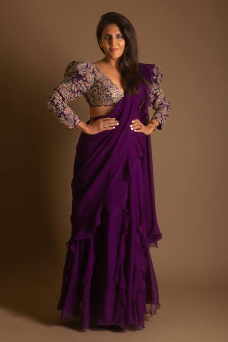 Mrunalini Rao_Purple Chiffon, Silk Embroidery V-neck Ruffle Saree With Multi Colored Blouse _at_Aza_Fashions
