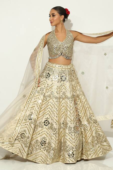 Vandana Sethi Gold Silk Crystals, Beads, Mirrors Halter Neck Floral Embellished Lehenga Set at Aza Fashions Vandana Sethi_Gold Silk Crystals, Beads, Mirrors Halter Neck Floral Embellished Lehenga Set _at_Aza_Fashions
