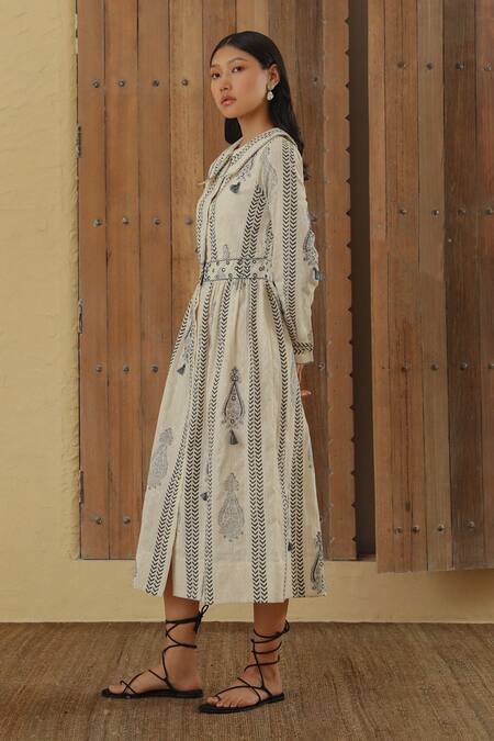 Muvazo White Cotton Tassels, Beads Scoop Neck Boteh Print A-line Dress Online at Aza Fashions Muvazo_White Cotton Tassels, Beads Scoop Neck Boteh Print A-line Dress _Online_at_Aza_Fashions