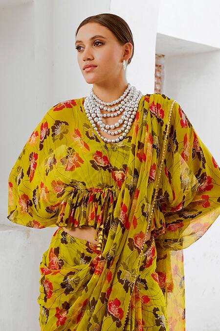 Shop Pallavi Jaipur Green Chiffon Beads, Fringe V-neck Poppy Planet Print Saree With Frilled Blouse Online at Aza Fashions Shop_Pallavi Jaipur_Green Chiffon Beads, Fringe V-neck Poppy Planet Print Saree With Frilled Blouse _Online_at_Aza_Fashions