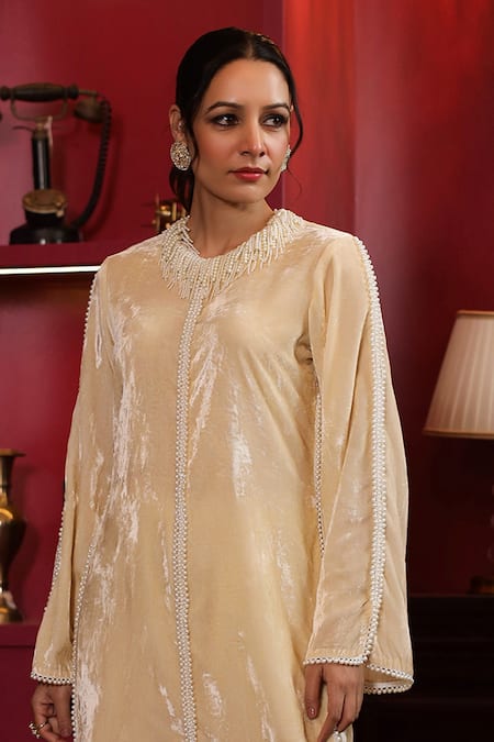 K-Anshika Off White Velvet Beads Round Neck Embellished Kurta And Flared Pant Set Online at Aza Fashions K-Anshika_Off White Velvet Beads Round Neck Embellished Kurta And Flared Pant Set _Online_at_Aza_Fashions