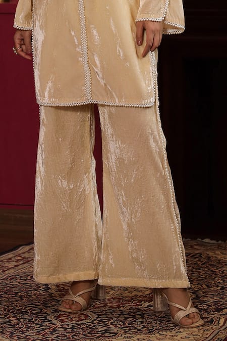 Buy K-Anshika Off White Velvet Beads Round Neck Embellished Kurta And Flared Pant Set Online at Aza Fashions Buy_K-Anshika_Off White Velvet Beads Round Neck Embellished Kurta And Flared Pant Set _Online_at_Aza_Fashions