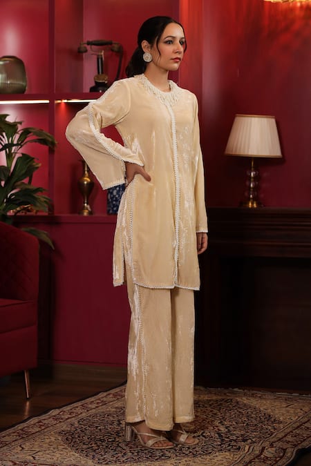 K-Anshika_Off White Velvet Beads Round Neck Embellished Kurta And Flared Pant Set _at_Aza_Fashions