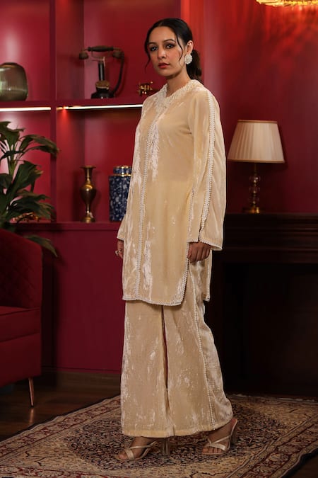 Buy_K-Anshika_Off White Velvet Beads Round Neck Embellished Kurta And Flared Pant Set 