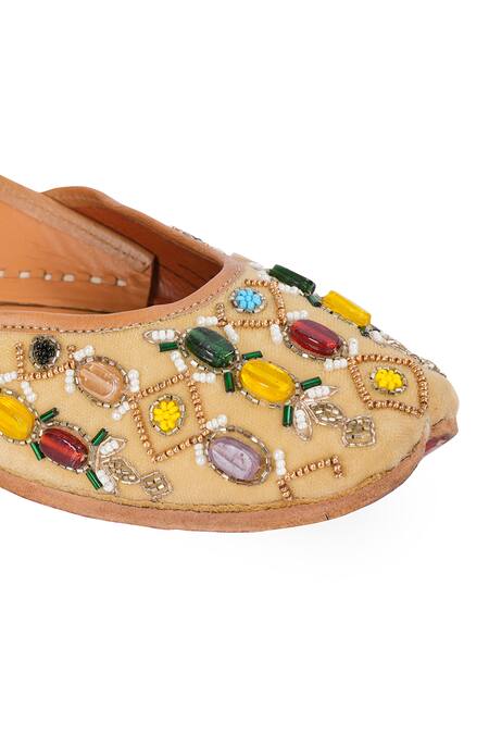 NR By Nidhi Rathi Beige Embellished Navaratnam Mojaris at Aza Fashions NR By Nidhi Rathi_Beige Embellished Navaratnam Mojaris _at_Aza_Fashions